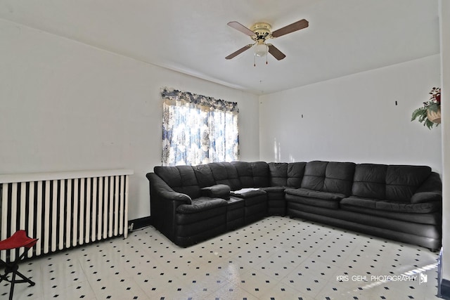 living room featuring ceiling fan and radiator heating unit