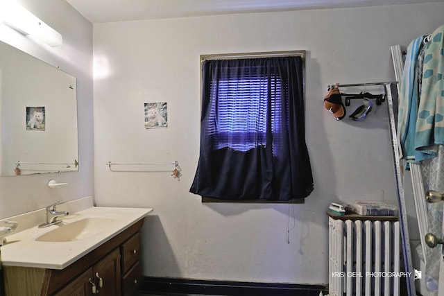 bathroom with vanity and radiator heating unit