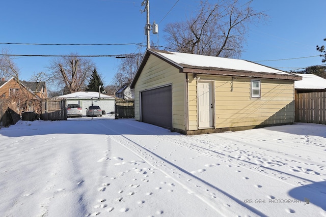 view of snow covered garage