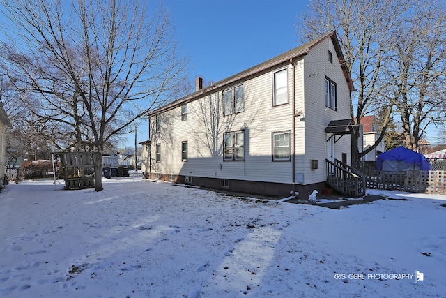 view of snow covered house