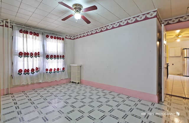 spare room with ceiling fan