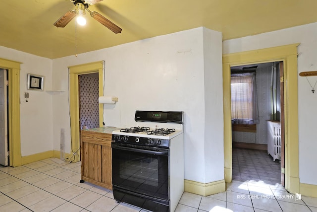 kitchen with ceiling fan and gas range gas stove