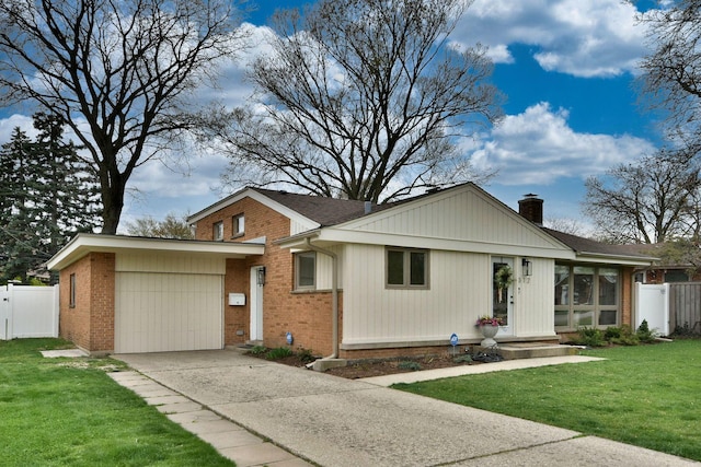 view of front facade with a front yard and a garage