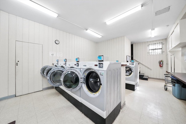 clothes washing area featuring washer and clothes dryer