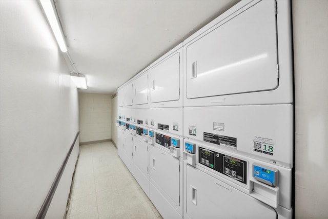 laundry room with washing machine and dryer and stacked washer and clothes dryer