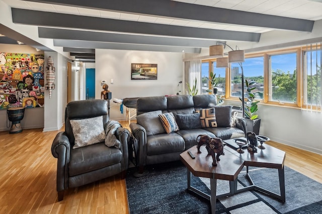 living room with beam ceiling and light wood-type flooring