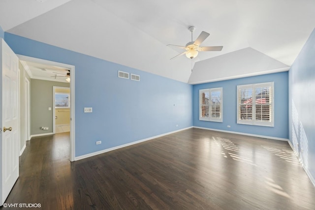 unfurnished room with ceiling fan, dark wood-type flooring, and lofted ceiling