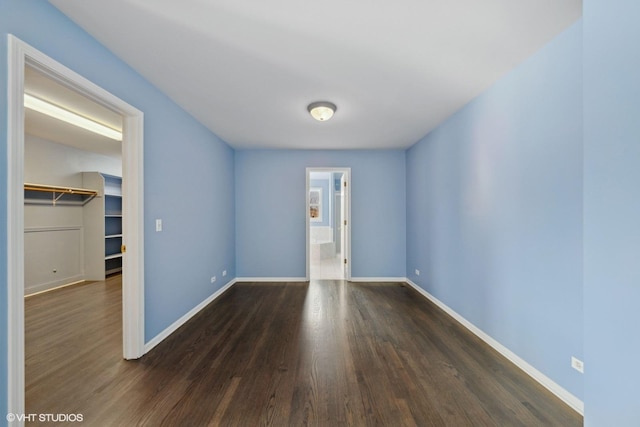 unfurnished room with dark hardwood / wood-style floors