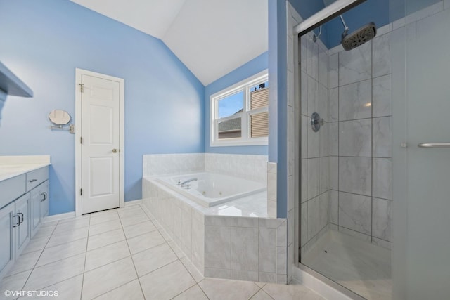 bathroom with tile patterned floors, vanity, independent shower and bath, and vaulted ceiling