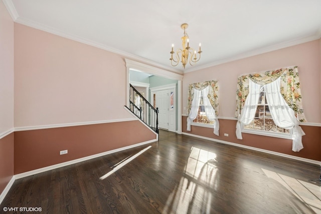 interior space with a chandelier, dark hardwood / wood-style flooring, and crown molding