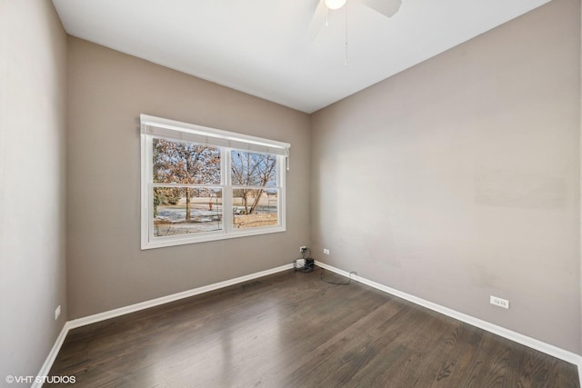 unfurnished room with ceiling fan and dark wood-type flooring