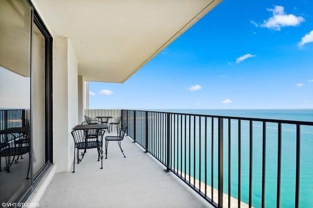 balcony featuring a water view