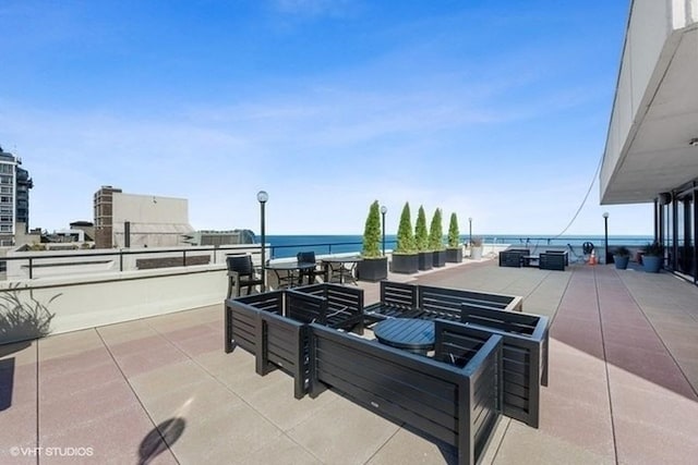 view of patio / terrace with a water view