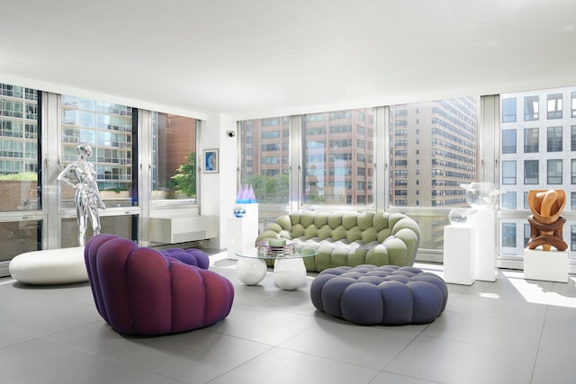 living room featuring tile patterned flooring and expansive windows