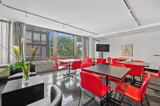 dining room featuring track lighting