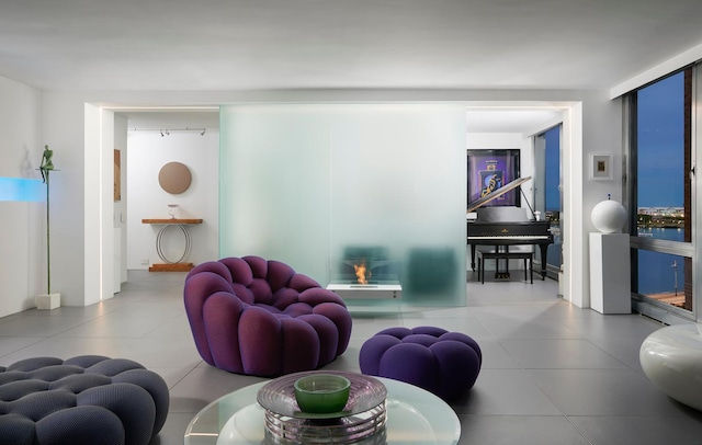 living room featuring tile patterned floors and a fireplace