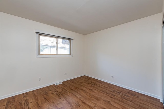 unfurnished room featuring wood-type flooring