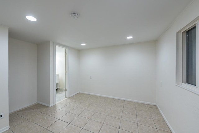 spare room with light tile patterned floors