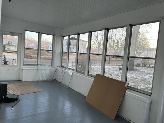 unfurnished sunroom with a wealth of natural light