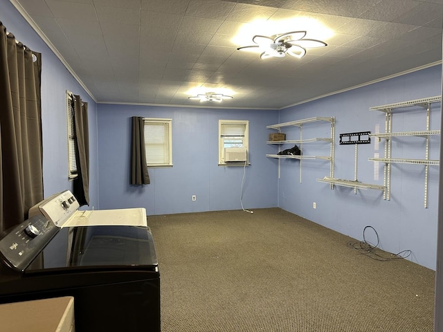 laundry room with ornamental molding, washer and clothes dryer, and carpet flooring