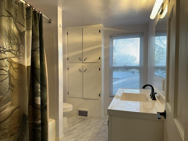 full bathroom featuring toilet, vanity, and shower / bathtub combination with curtain