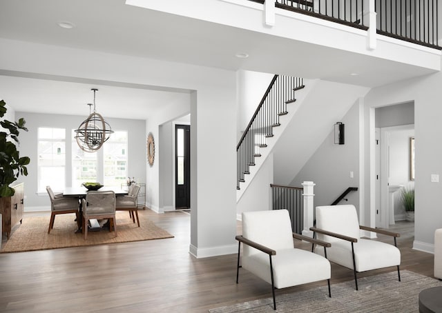 interior space with an inviting chandelier and dark hardwood / wood-style floors