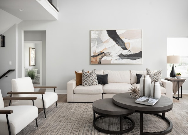 living room featuring hardwood / wood-style flooring and lofted ceiling