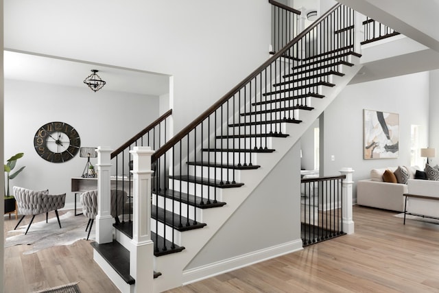 stairs featuring hardwood / wood-style flooring