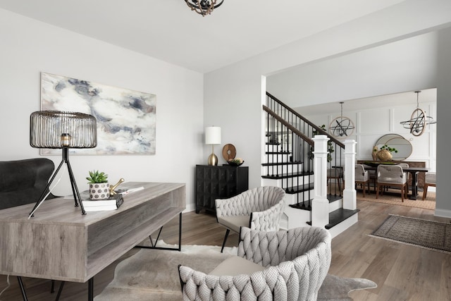 living room featuring hardwood / wood-style flooring and a notable chandelier