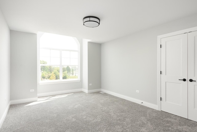 empty room featuring carpet flooring