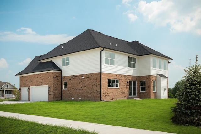 back of house with a garage and a lawn