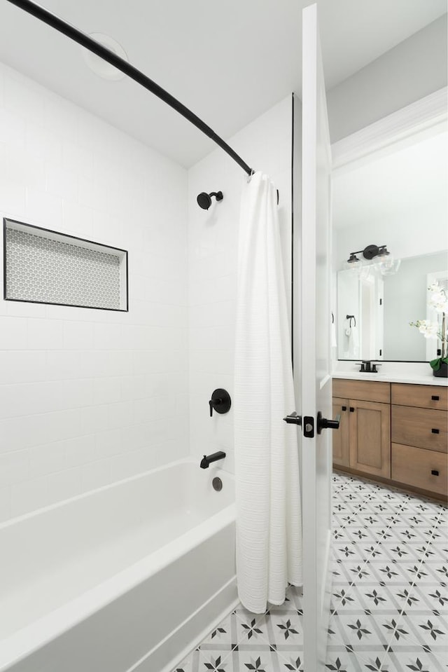 bathroom featuring shower / bath combo with shower curtain and vanity