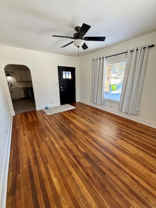 entryway featuring ceiling fan, hardwood / wood-style flooring, and sink