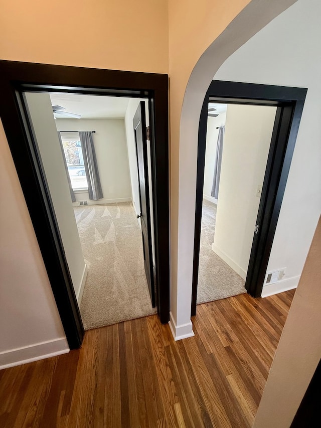 hall featuring wood-type flooring