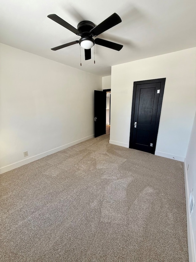 unfurnished bedroom with ceiling fan and light carpet