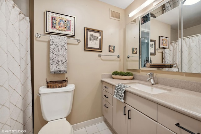 bathroom with tile patterned floors, vanity, a shower with shower curtain, and toilet