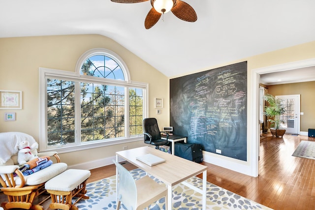 office area featuring ceiling fan, a wealth of natural light, wood-type flooring, and vaulted ceiling