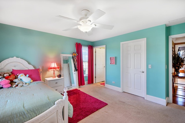 carpeted bedroom featuring ceiling fan