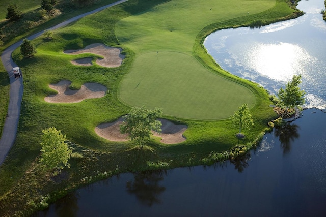 aerial view featuring a water view and golf course view