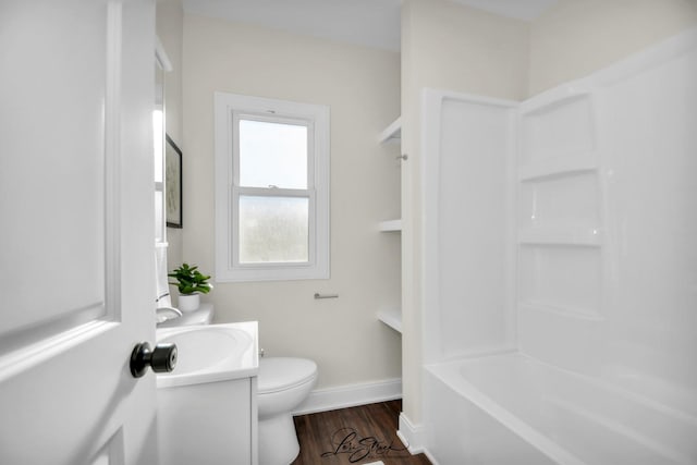 full bathroom with vanity, hardwood / wood-style flooring, toilet, and shower / washtub combination