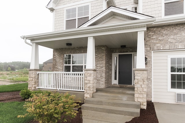 entrance to property featuring a porch