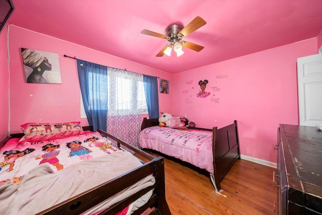 bedroom featuring ceiling fan and hardwood / wood-style floors