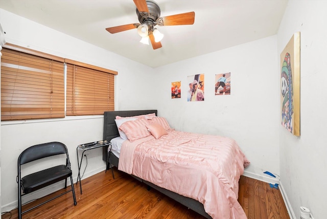 bedroom featuring ceiling fan and wood-type flooring