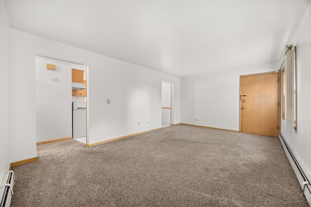 unfurnished room with carpet floors and baseboard heating