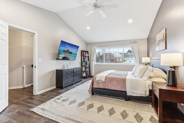 bedroom featuring dark hardwood / wood-style flooring, vaulted ceiling, and ceiling fan