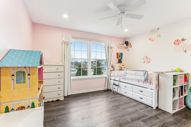 bedroom with dark hardwood / wood-style flooring and ceiling fan