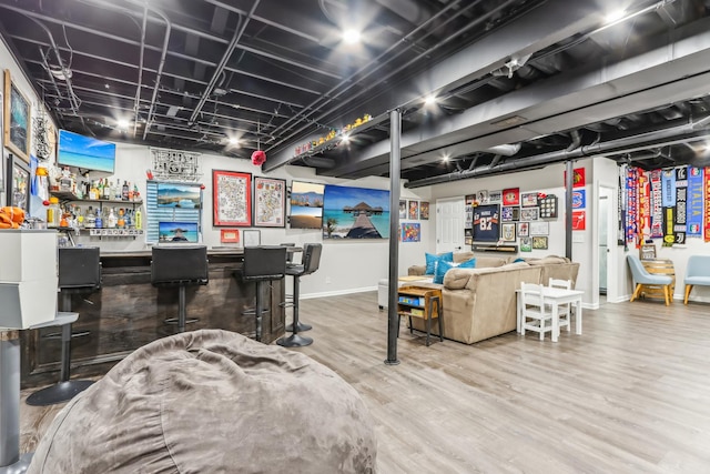 playroom featuring indoor bar and wood-type flooring