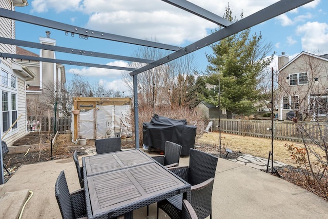 view of patio featuring area for grilling and a pergola