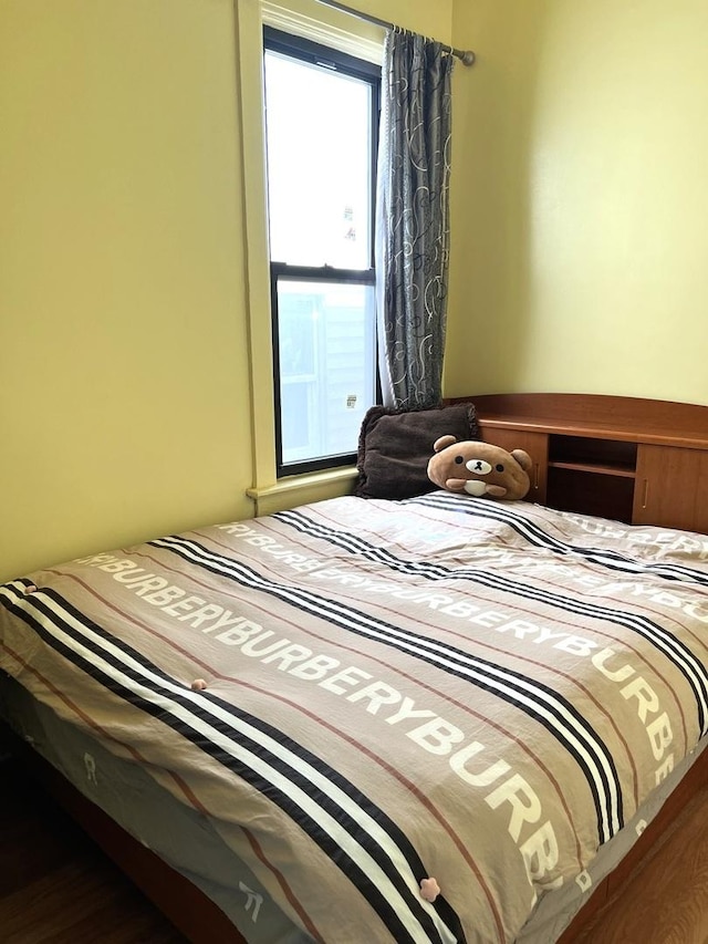 bedroom featuring hardwood / wood-style flooring