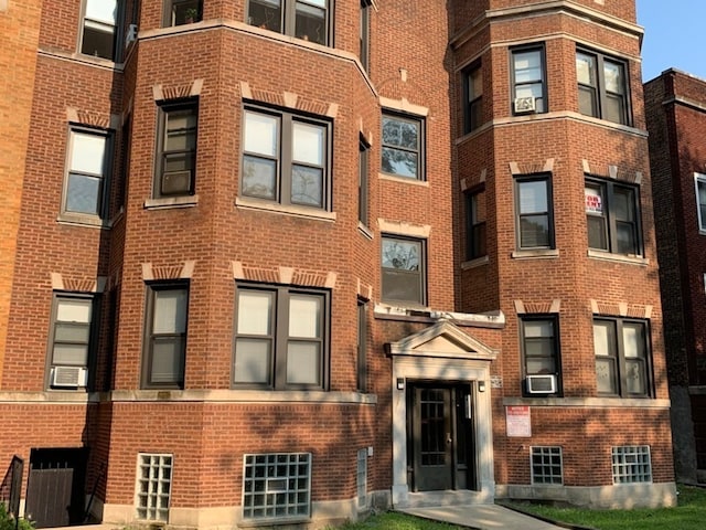 view of building exterior with cooling unit